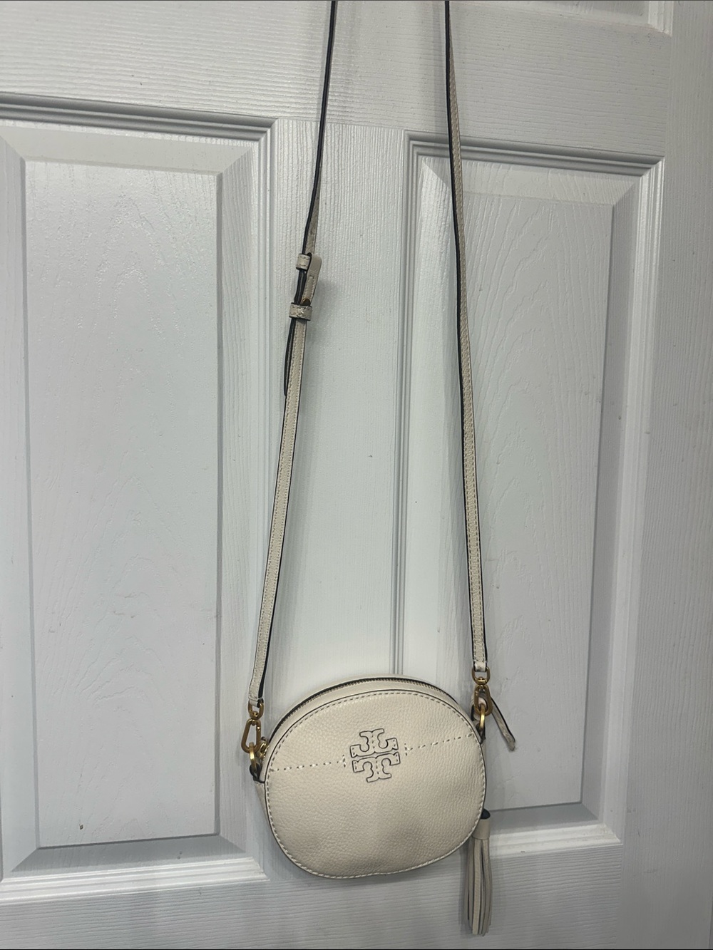 Tory Burch Round Cream Crossbody Bag with Tassel Accent